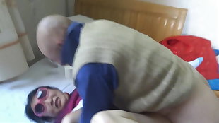 Asian grannie is having joy with granddad